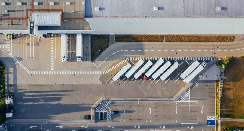 production, facility, logistic, distribution center, transit, truck, transport, top view, industrial, semi, aerial view, heavy, depot, germany, warehouse, container truck, shipping containers, storehouse, road, loading bay, factory, unloading, distribute, unload, europe, aerial photography, production, logistic, truck, truck, warehouse, warehouse, warehouse, warehouse, warehouse