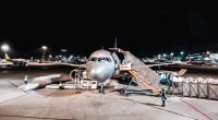 person standing near airliner