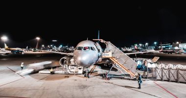 person standing near airliner