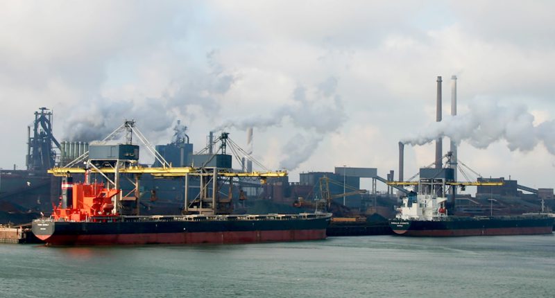 red and white ship on sea under white clouds during daytime