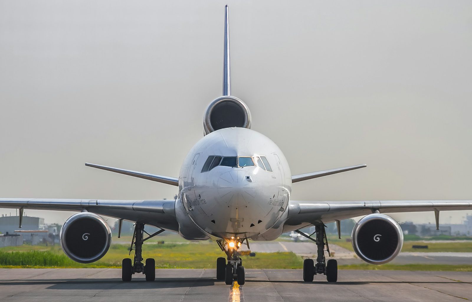 a large jetliner sitting on top of an airport runway
