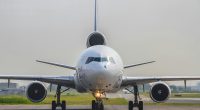 a large jetliner sitting on top of an airport runway