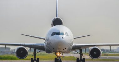 a large jetliner sitting on top of an airport runway
