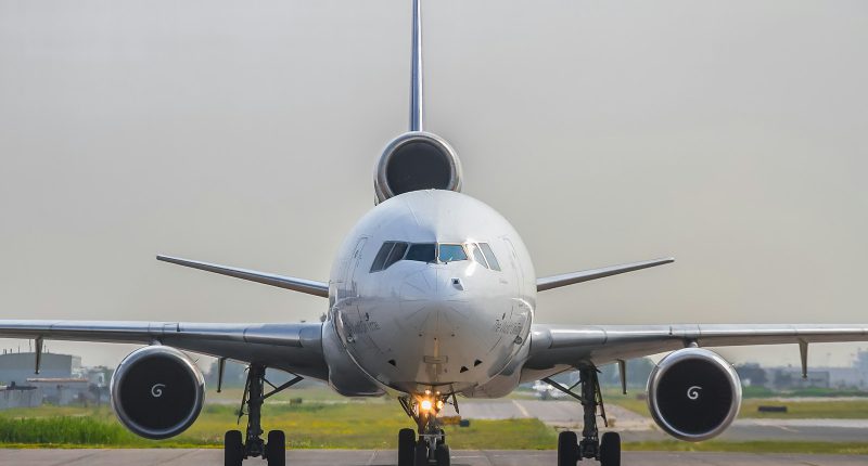 a large jetliner sitting on top of an airport runway